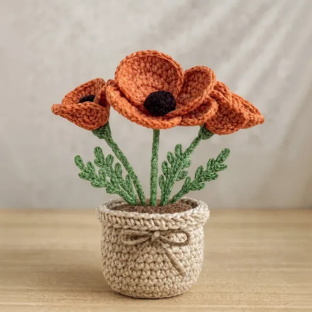 Plantinha de crochê em amigurumi: papoula laranja, em vasinho
